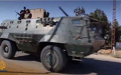 Egyptian armored vehicle in the Sinai Peninsula. (screen capture: YouTube/Al Jazeera English)