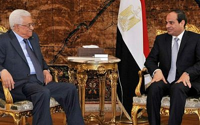 Egypt's President Abdel-Fattah el-Sissi (right) meets with Palestinian Authority President Mahmoud Abbas (left) in Cairo, Egypt, on July 17, 2014. (photo credit: AFP/HO/Egyptian Presidency)