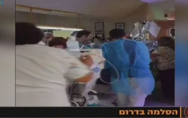 Medical personnel in the Soroka Medical Center in Beersheba move premature babies to protected rooms (screen capture: Channel 10)