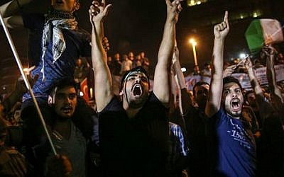 Illustrative: Pro-Palestinian Turks shout slogans against Israel during a protest rally outside the Israeli consulate in Istanbul, Turkey, early Friday, July 18, 2014 (photo credit: AP/Emrah Gurel)