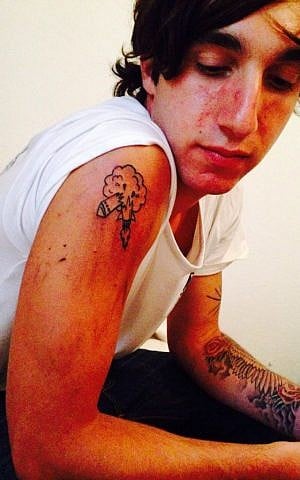 Will inks the Iron Dome on his bicep (Courtesy xx)
