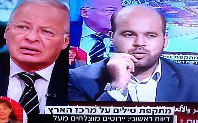 Channel 2's Ehud Yaari left) speaks to Hamas's Al-Aksa TV presenter, live on both stations (Channel 2 screenshot) Channel 2's Ehud Yaari left) speaks to Hamas's Al-Aksa TV presenter, live on both stations (Channel 2 screenshot)