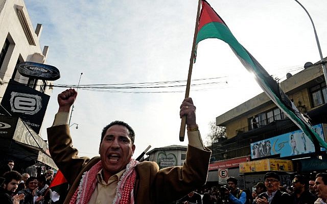 People take part in a demonstration outside the La Moneda presidential palace in Santiago, Chile, on August 02, 2014, to protest against Israel's military campaign in Gaza. (photo credit: AFP/ MARTIN BERNETTI)