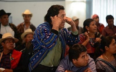 Pedro Vasquez, leader of San Juan La Laguna community, speaks during a meeting with members of the Orthodox Jewish community at the headquarters of the Humang Rights Office in Guatemala City on August 27,2014. (Photot credit: AFP/ Johan ORDONEZ)
