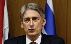 FILE: British Foreign Secretary Philip Hammond speaks during a joint press conference with Prime Minister Benjamin Netanyahu on July 24, 2014, at the Knesset. (photo credit:  Gali Tibbon/AFP)