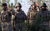 Iraqi Kurdish Peshmerga fighters take position on the front line in Makhmur, some 50 kilometers south of Arbil, the capital of the autonomous Kurdish region of northern Iraq where clashes with Islamic State (IS) militants are ongoing, on August 9, 2014 (photo credit: AFP/SAFIN HAMED)