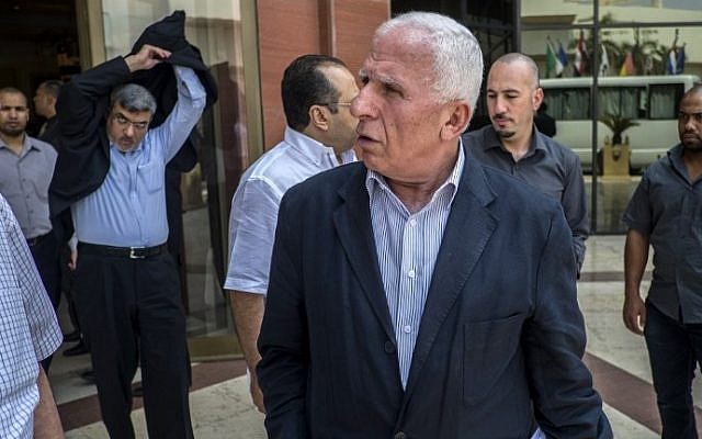 Palestinian Fatah delegation chief Azzam al-Ahmed, center, and members of the Palestinian Fatah delegation leave the hotel where the negotiations are taking place with Egyptian intelligence mediators aimed at brokering an end to the Gaza conflict on August 12, 2014 in the Egyptian capital, Cairo. (photo credit: AFP/KHALED DESOUKI) Palestinian Fatah delegation chief Azzam al-Ahmed, center, and members of the Palestinian Fatah delegation leave the hotel where the negotiations are taking place with Egyptian intelligence mediators aimed at brokering an end to the Gaza conflict on August 12, 2014 in the Egyptian capital, Cairo. (photo credit: AFP/KHALED DESOUKI)