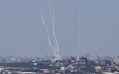 A photo from the Israeli side of the Israel-Gaza border shows a smoke trail of rockets being fired by Palestinian terrorists from the Gaza Strip into Israel, August 22, 2014. (AFP/Jack Guez)