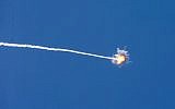 Illustrative: A picture taken from the southern Israeli border with the Gaza Strip shows the trail of a missile launched by Israel's Iron Dome defense system, on August 22, 2014 (AFP Photo/Jack Guez)