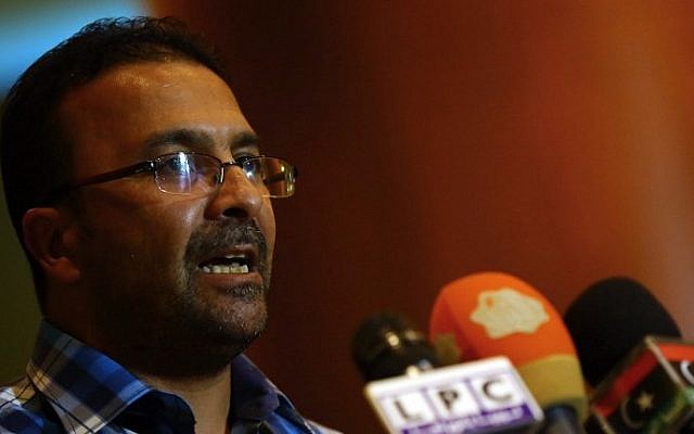 Mohammed Hadia spokesman for Islamist Fajr Libya operation (Dawn of Libya) gives a press conference in Tripoli on August 23, 2014 accusing the UAE and Egypt of being involved in the two air raids against the Libyan Islamist forces in the past week. (photo credit: AFP/MAHMUD TURKIA)