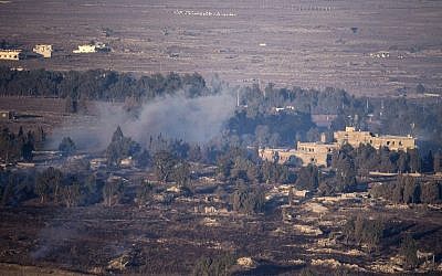 Smoke rises from the Syrian village of Quneitra, as seen from the Israeli Golan Heights, on August 27, 2014 (photo credit: AFP/JACK GUEZ) Smoke rises from the Syrian village of Quneitra, as seen from the Israeli Golan Heights, on August 27, 2014 (photo credit: AFP/JACK GUEZ)