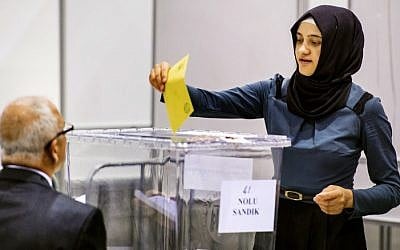 A woman casts her ballot for the Turkish presidential election in a polling station created in convention center Ahoy in Rotterdam on July 31, 2014. (photo credit: AFP/ANP/REMKO DE WAAL)