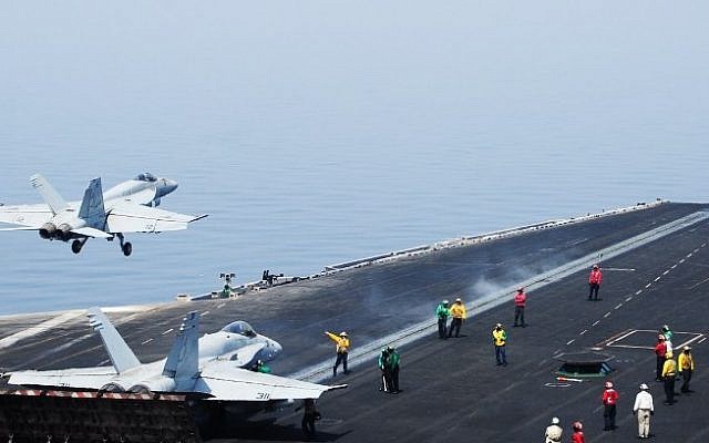 An F/A-18E Super Hornet takes off from the flight deck of the aircraft carrier USS George H.W. Bush (CVN 77)on August 1, 2014 in the Gulf (Photo credit: AFP/US NAVY/Joshua Card) An F/A-18E Super Hornet takes off from the flight deck of the aircraft carrier USS George H.W. Bush (CVN 77)on August 1, 2014 in the Gulf (Photo credit: AFP/US NAVY/Joshua Card)