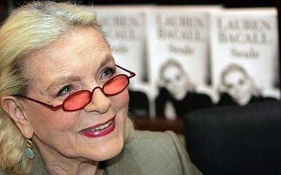 This May 7, 2005 file photo shows US actress Lauren Bacall signing copies of her autobiography at a book shop in Paris, France. (Photo credit: AFP/PIERRE ANDRIEU / Files)