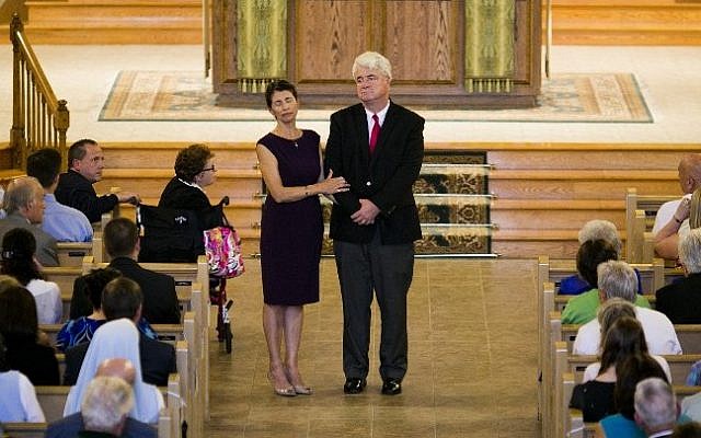 Diane and John Foley, parents of James Foley, address the congregation during a Catholic mass at Our Lady of the Holy Rosary parish August 24, 2014, in Rochester, New Hampshire (Photo credit: Dominick Reuter/AFP ) Diane and John Foley, parents of James Foley, address the congregation during a Catholic mass at Our Lady of the Holy Rosary parish August 24, 2014, in Rochester, New Hampshire (Photo credit: Dominick Reuter/AFP )