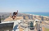Sergey, 24, doing a backflip on a skyscraper in Ashdod (photo credit: YouTube screen grab)