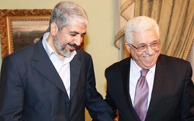 Khaled Mashaal, political leader of Hamas (left), meets with Palestinian Authority President Mahmoud Abbas in Cairo, Egypt, December 21, 2011. (photo credit: AP) Khaled Mashaal, political leader of Hamas (left), meets with Palestinian Authority President Mahmoud Abbas in Cairo, Egypt, December 21, 2011. (photo credit: AP)
