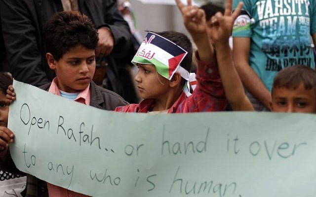 Yemeni boys attend a protest supporting Gaza in front of the Egyptian embassy in Sanaa, Yemen, August 5, 2014  [photo credit: AP/Hani Mohammed]