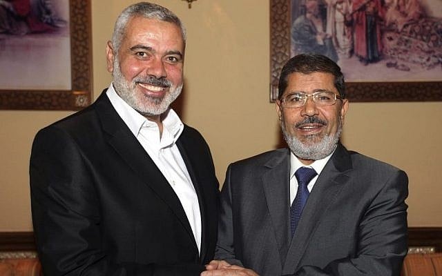 Egyptian President Mohammed Morsi, right, meets the Hamas Prime Minister of Gaza, Ismail Haniyeh in Cairo, Egypt, July 26, 2012 photo credit: AP) Egyptian President Mohammed Morsi, right, meets the Hamas Prime Minister of Gaza, Ismail Haniyeh in Cairo, Egypt, July 26, 2012 photo credit: AP)