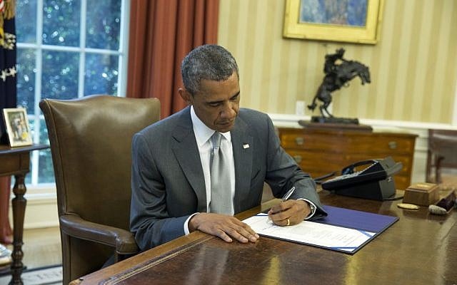 President Barack Obama signs "H.J. Res. 76," a bill that provides an additional $225 million in US taxpayer dollars for Israel's Iron Dome missile defense system, in the Oval Office of the White House, Monday, Aug. 4, 2014, in Washington. (photo credit: AP Photo/ Evan Vucci) President Barack Obama signs "H.J. Res. 76," a bill that provides an additional $225 million in US taxpayer dollars for Israel's Iron Dome missile defense system, in the Oval Office of the White House, Monday, Aug. 4, 2014, in Washington. (photo credit: AP Photo/ Evan Vucci)