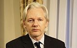 WikiLeaks founder Julian Assange sits inside the Ecuadorian Embassy in London, July 30, 2013. (AP/Sunshine Press Productions, File)