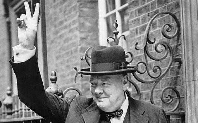 Winston Churchill in Downing Street giving his famous 'V' sign, 1943. (photo credit: Imperial War Museums/public domain)