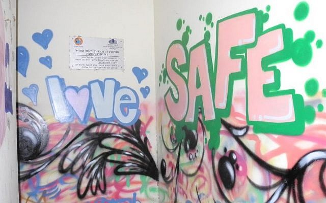 New York Graffiti artist "Broker" transformed the painted walls inside and outside of the bomb shelter into a cohesive mural, though his message could be interpreted a number of different ways. (Melanie Lidman/Times of Israel) New York Graffiti artist "Broker" transformed the painted walls inside and outside of the bomb shelter into a cohesive mural, though his message could be interpreted a number of different ways. (Melanie Lidman/Times of Israel)