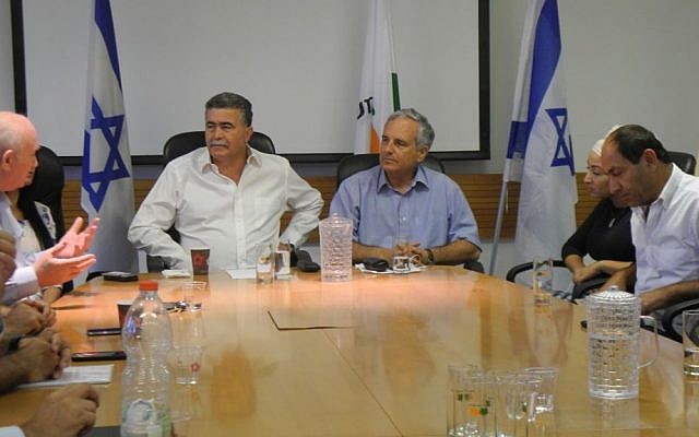 Environmental Protection Minister Amir Peretz and the CEOs of the largest Israeli supermarkets at a meeting on Wednesday to discuss an upcoming law that will require customers to pay 40 agorot for every plastic bag they use with their purchases. (photo credit: Melanie Lidman/Times of Israel) Environmental Protection Minister Amir Peretz and the CEOs of the largest Israeli supermarkets at a meeting on Wednesday to discuss an upcoming law that will require customers to pay 40 agorot for every plastic bag they use with their purchases. (photo credit: Melanie Lidman/Times of Israel)