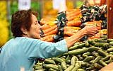 Illustrative photo of a woman shopping for produce in a supermarket. (Abir Sultan/Flash90)