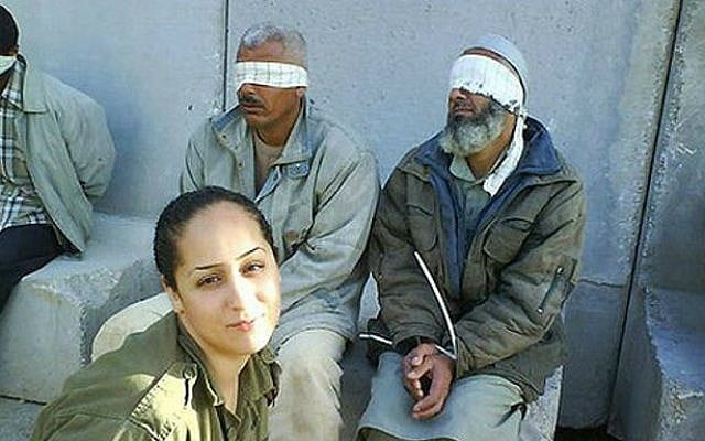 IDF soldier Eden Abergil, who photographed herself next to detained Palestinian prisoners, and published her photos on Facebook, 2010. (photo credit: Sachim.Tumbler.com/Flash90) IDF soldier Eden Abergil, who photographed herself next to detained Palestinian prisoners, and published her photos on Facebook, 2010. (photo credit: Sachim.Tumbler.com/Flash90)