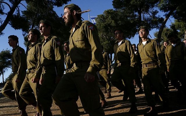 Haredi recruits march during a swearing-in ceremony as they enter the orthodox Jewish IDF "Nahal Haredi" unit, at Ammunition Hill in Jerusalem on May 26, 2012. Photo by Miriam Alster/FLASH90) Haredi recruits march during a swearing-in ceremony at Ammunition Hill, Jerusalem, May 26, 2012 photo credit: Miriam Alster/FLASH90)