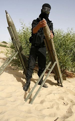 Palestinian militants of Al-Nasser Brigades, the armed wing of the Popular Resistance Committees, show their combat skills during a graduation ceremony in Rafah in the southern Gaza Strip on June 2, 2013 (photo credit: Abed Rahim Khatib/Flash90)