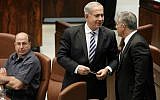 Defense Minister Moshe Ya'alon looks over at Prime Minister Benjamin Netanyahu speaking with Finance Minister Yair Lapid during a plenum session in the Israeli parliament on June 05, 2013. (photo credit: Miriam Alster/FLASH90)