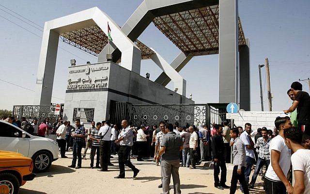 Palestinians wait to cross into Egypt at the Rafah border crossing between Egypt and the southern Gaza Strip on June 17, 2014 (photo credit: Abed Rahim Khatib/Flash90) Palestinians wait to cross into Egypt at the Rafah border crossing between Egypt and the southern Gaza Strip on June 17, 2014 (photo credit: Abed Rahim Khatib/Flash90)