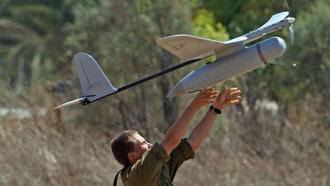 An Israeli soldier seen launching a drone, an unmanned aerial vehicle equipped with cameras that produces video images of the battlefield and provides full, aerial real-time intelligence images to forces in the field, on the seventh day of Operation Protective Edge, on July 14, 2014. (Yossi Aloni/Flash90) An Israeli soldier seen launching a drone, an unmanned aerial vehicle equipped with cameras that produces video images of the battlefield and provides full, aerial real-time intelligence images to forces in the field, on the seventh day of Operation Protective Edge, on July 14, 2014. (Yossi Aloni/Flash90)