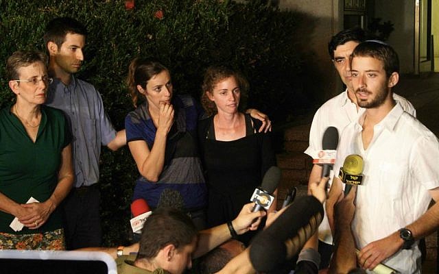 Zur Goldin (R), brother of Israeli soldier Hadar Goldin, and other family members talk to the media outside their home in the central Israeli city of Kfar Saba on August 2, 2014. (Photo by Flash90) Zur Goldin (R), brother of Israeli soldier Hadar Goldin, and other family members talk to the media outside their home in the central Israeli city of Kfar Saba on August 2, 2014. (Photo by Flash90)