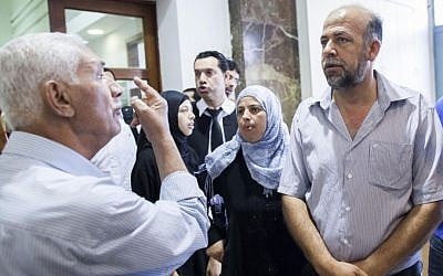 The family of Muhammed Abu Khdeir is seen outside the Jerusalem District after a court hearing against the 16-year-old youth's suspected killer. (photo credit: Yonatan Sindel/Flash90) The family of Muhammed Abu Khdeir is seen outside the Jerusalem District after a court hearing against the 16-year-old youth's suspected killer. (photo credit: Yonatan Sindel/Flash90)