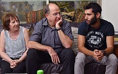 Then-defense minister Moshe Ya'alon visits the family of IDF Golani Brigade soldier St.-Sgt. Oron Shaul in the northern village of Poria on August 10, 2014 (Photo credit: Ariel Hermoni/Ministry of Defense/Flash90)
