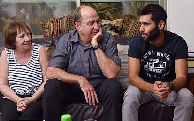 Then-defense minister Moshe Ya'alon visits the family of IDF Golani Brigade soldier St.-Sgt. Oron Shaul in the northern village of Poria on August 10, 2014 (Photo credit: Ariel Hermoni/Ministry of Defense/Flash90)