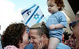 New immigrants from USA and Canada arrive on a special 'Aliyah Flight 2014' on behalf of the Jewish Agency and the Nefesh B'Nefesh organization, at Ben-Gurion airport in central Israel, August 12, 2014. (Gideon Markowicz/FLASH90)