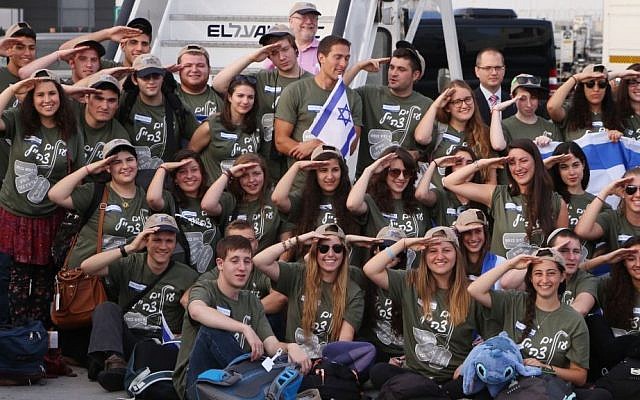 Some of the more than 100 men and women who immigrated to Israel to join the IDF, Ben Gurion airport, August 12, 2014. (photo credit: Flash90)