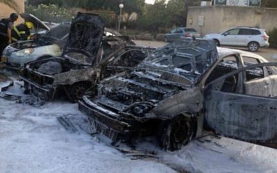 Firefighters try to extinguish the fire at the site where a mortar shell landed and killed a 4-year-old Daniel Tragerman in Kibbutz Nahal Oz in the southern Israeli on August 22, 2014. (photo credit: Southern Region Fire Department Spokesperson) 
