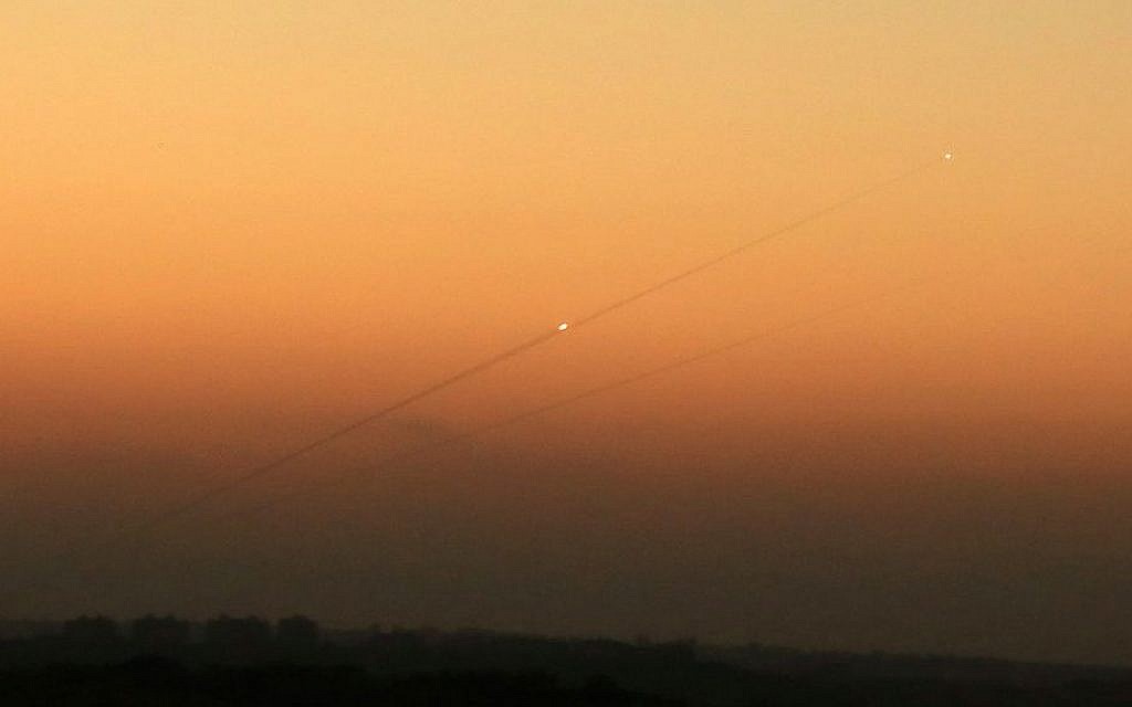 Illustrative: A trail of smoke from a rocket as it was launched from the Gaza Strip toward the southern Israeli city of Ashkelon, August 24, 2014. (Edi Israel/Flash90/File)