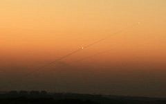 Illustrative: A trail of smoke from a rocket as it was launched from the Gaza Strip toward the southern Israeli city of Ashkelon, August 24, 2014. (Edi Israel/Flash90/File)