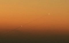 Illustrative. A trail of smoke is seen as rockets launched from the Gaza Strip streak towards the southern Israeli city of Ashkelon on August 24, 2014. (Edi Israel /Flash90/File)
