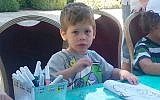 Daniel Tragerman, 4, seen during a visit at the presidential residence in Jerusalem in early August 2014. Daniel was killed by shrapnel from a mortar shell that hit his home in Kibbutz Nahal Oz on Friday, August 22, 2014. He was laid to rest on August 24. (Photo by Flash90)