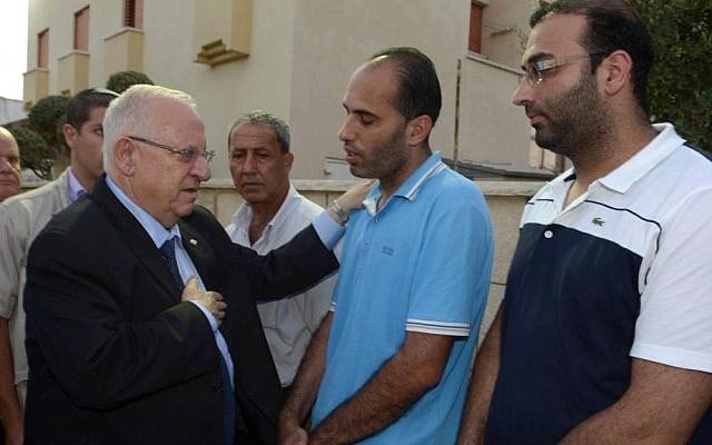 President Reuven Rivlin visits the family of the late Yussuf Haj Yahya, in the Israeli-Arab city of Taybe, on August 28, 2014. Haj, a principal at the Amal school in Taybe, was murdered on August 24 at his school. (Photo credit: Mark Neyman/GPO/Flash90) President Reuven Rivlin visits the family of the late Yussuf Haj Yahya, in the Israeli-Arab city of Taybe, on August 28, 2014. Haj, a principal at the Amal school in Taybe, was murdered on August 24 at his school. (Photo credit: Mark Neyman/GPO/Flash90)