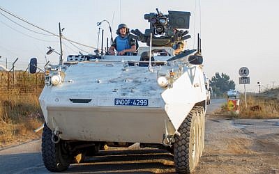 A UN peacekeeper on an armored personnel carrier (APC) along the Israel-Syrian border on August 30, 2014 (photo credit: Flash90)