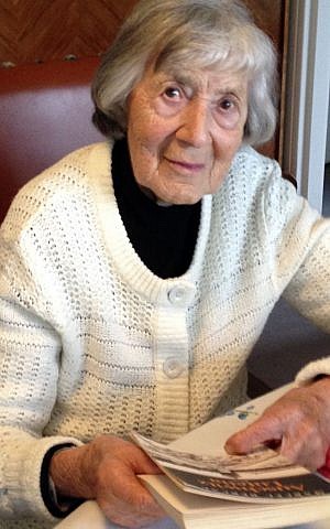 This Tuesday Aug. 19, 2014 photo shows Josepha Bercau, 93, answering a reporter during an interview with the Associated Press in Paris. Josepha Bercau remembers the Nazi occupation of Paris, the deportation to Auschwitz for three years of the man she’d later marry and the small acts of sabotage she and others carried out. (photo credit: AP Photo/Elaine Ganley)