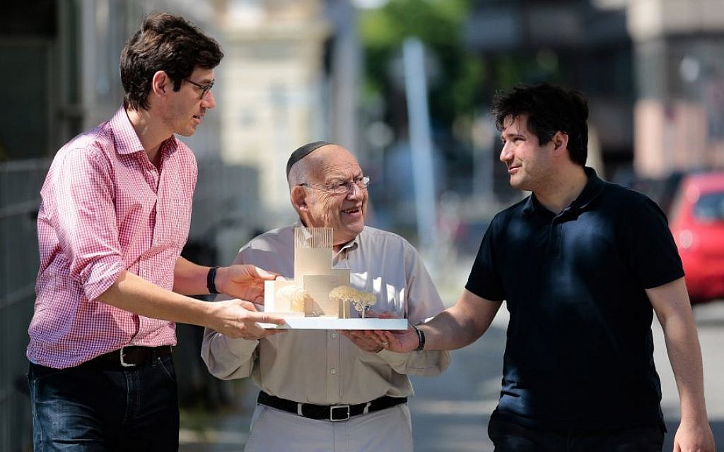 In this Friday, July 4, 2014 photo, Protestant priest Gregor Hohberg, Rabbi Tovia Ben-Chorin and Imam Kadir Sanci, from left, show a model of the planned prayer and education building House of One prior to an interview with The Associated Press in Berlin. House of One will house a synagogue, a Christian church and a mosque. (AP Photo/Markus Schreiber) In this Friday, July 4, 2014 photo, Protestant priest Gregor Hohberg, Rabbi Tovia Ben-Chorin and Imam Kadir Sanci, from left, show a model of the planned prayer and education building House of One prior to an interview with The Associated Press in Berlin. House of One will house a synagogue, a Christian church and a mosque. (AP Photo/Markus Schreiber)